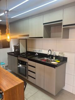 2 quartos sendo 1 suíte e 2 vgs de garagem