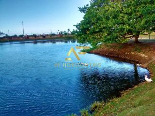 Lote em frente ao lago no Condomínio Melício Machado, Aruana (15x30 m²).