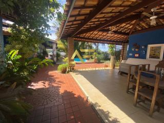 Casa com piscina no Condomínio Melício Machado (2 lotes), Aruana, com 3 suítes.