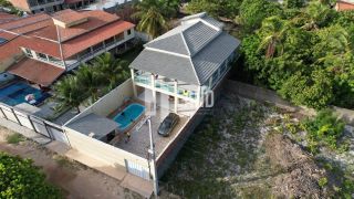 Casa Duplex para vender na praia de Paracuru/CE com 5 quartos (4 suítes), 2 banheiros sociais, piscina, deck com churrasqueira, 4 vagas - 415m² (casa) - 600m² (terreno) - R$ 399.000  - Paracuru/CE