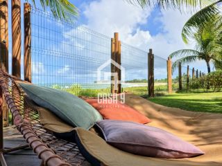 Apartamento térreo 3 suítes pé na areia a venda no condomínio Lua Nova em Itacimirim Bahia
