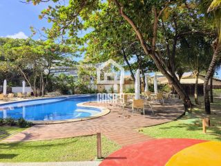 Apartamento térreo 3 suítes pé na areia a venda no condomínio Lua Nova em Itacimirim Bahia