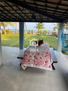 Casa pé na areia e terreno de 1050m² em Itacimirim-Ba