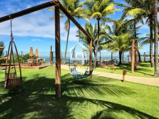 Apartamento térreo mobiliado pé na areia 3 suítes a venda no Porto Feliz em Itacimirim na Praia da Espera em Itacimirim Bahia