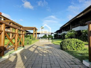 Apartamento mobiliado a venda com 2 suítes pé na areia em Itacimirim Bahia
