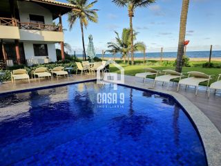 Apartamento mobiliado a venda com 2 suítes pé na areia em Itacimirim Bahia