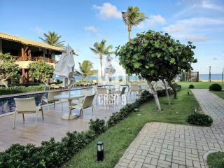 Apartamento mobiliado a venda com 2 suítes pé na areia em Itacimirim Bahia