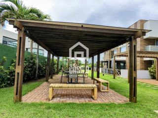 Apartamento pé na areia com 3 suítes mobiliado a venda em Itacimirim Bahia