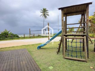 Apartamento térreo duplex mobiliado frente mar com 2 suites no Alphaville Guarajuba Bahia