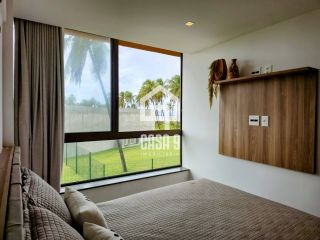 Apartamento térreo duplex mobiliado frente mar com 2 suites no Alphaville Guarajuba Bahia
