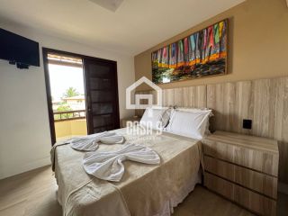 Apartamento a venda com 2 suítes no condomínio Bali Bahia frente mar em Praia do Forte Bahia