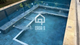 Casa a venda mobiliada com 8 suítes no condomínio Quintas das Lagoas com acesso ao mar pela ponte em Itacimirim Bahia