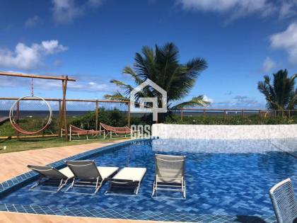 Apartamento mobiliado com 3 quartos pé na areia à venda em Itacimirim Bahia