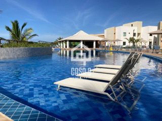 Apartamento térreo mobiliado com 3 quartos pé na areia à venda em Itacimirim Bahia