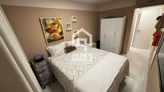 Apartamento térreo mobiliado com 3 quartos pé na areia à venda em Itacimirim Bahia