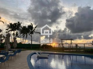Apartamento térreo mobiliado com 3 quartos pé na areia à venda em Itacimirim Bahia