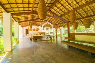 Casa térrea em terreno privativo com 4 suítes para aluguel anual no condomínio Fazenda Praia do Forte Bahia