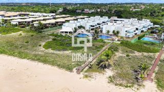 Apartamento garden mobiliado com 3 quartos pé na areia à venda em Itacimirim Bahia