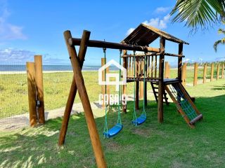 Apartamento térreo nunca habitado pé na areia com 3 suítes a venda no Mamont em Itacimirim Bahia