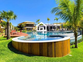 Apartamento térreo a venda com 3 suítes mobiliado no Porto da Espera em Itacimirim Bahia