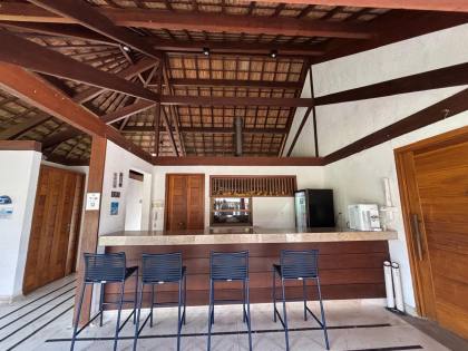 Apartamento térreo a venda com 2 suítes no Village das Acácias Piscinas Naturais Praia do Forte Bahia