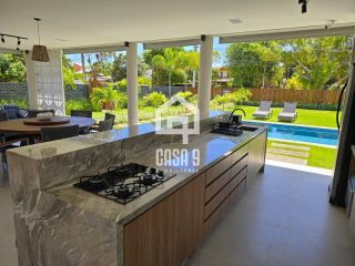 Casa térrea mobiliada com 5 suítes a venda no condomínio Enseada Praia da Espera em Itacimirim Bahia