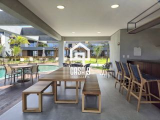 Apartamento mobiliado térreo com 3 suítes frontal mar a venda no condomínio Bali Exclusive em Itacimirim Bahia