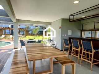 Apartamento mobiliado térreo com 3 suítes frontal mar a venda no condomínio Bali Exclusive em Itacimirim Bahia