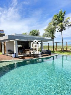 Apartamento mobiliado térreo com 3 suítes frontal mar a venda no condomínio Bali Exclusive em Itacimirim Bahia