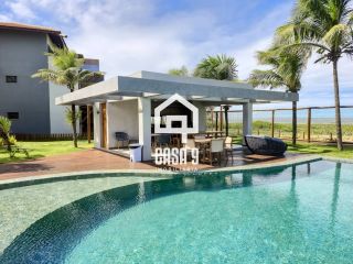 Apartamento mobiliado térreo com 3 suítes frontal mar a venda no condomínio Bali Exclusive em Itacimirim Bahia