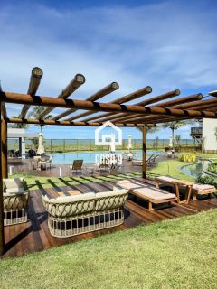 Apartamento mobiliado térreo com 3 suítes frontal mar a venda no condomínio Bali Exclusive em Itacimirim Bahia