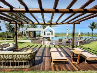 Apartamento mobiliado térreo com 3 suítes frontal mar a venda no condomínio Bali Exclusive em Itacimirim Bahia