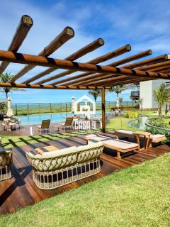 Apartamento mobiliado térreo com 3 suítes frontal mar a venda no condomínio Bali Exclusive em Itacimirim Bahia
