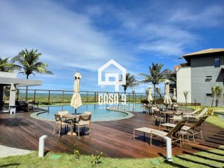 Apartamento mobiliado térreo com 3 suítes frontal mar a venda no condomínio Bali Exclusive em Itacimirim Bahia
