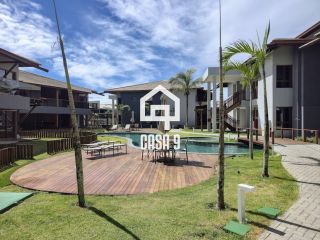 Apartamento mobiliado térreo com 3 suítes frontal mar a venda no condomínio Bali Exclusive em Itacimirim Bahia