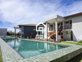Apartamento mobiliado térreo com 3 suítes frontal mar a venda no condomínio Bali Exclusive em Itacimirim Bahia