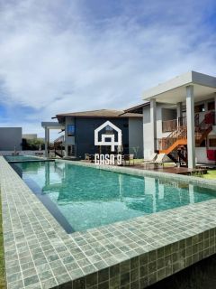 Apartamento mobiliado térreo com 3 suítes frontal mar a venda no condomínio Bali Exclusive em Itacimirim Bahia