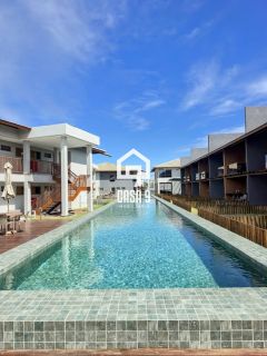 Apartamento mobiliado térreo com 3 suítes frontal mar a venda no condomínio Bali Exclusive em Itacimirim Bahia