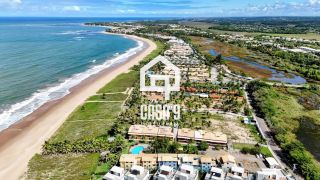 Apartamento mobiliado térreo com 3 suítes frontal mar a venda no condomínio Bali Exclusive em Itacimirim Bahia