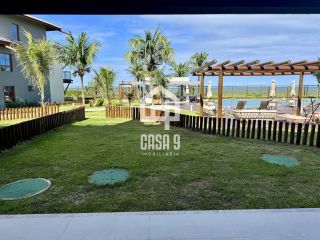 Apartamento mobiliado térreo com 3 suítes frontal mar a venda no condomínio Bali Exclusive em Itacimirim Bahia