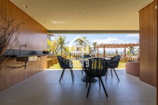 Apartamento mobiliado térreo com 3 suítes frontal mar a venda no condomínio Bali Exclusive em Itacimirim Bahia