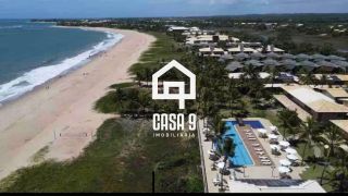 Apartamento duplex nascente com 3 suítes pé na areia e mobiliado a venda em Itacimirim Bahia