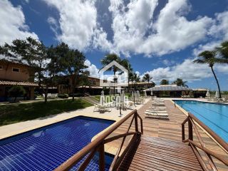 Apartamento duplex nascente com 3 suítes pé na areia e mobiliado a venda em Itacimirim Bahia