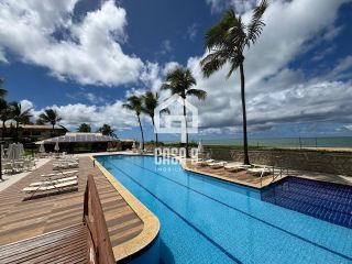 Apartamento duplex nascente com 3 suítes pé na areia e mobiliado a venda em Itacimirim Bahia