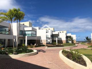 Apartamento mobiliado com 3 quartos pé na areia à venda em Itacimirim Bahia