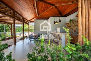 Casa duplex com gardem e 3 quartos pra alugar anual no Condominio Alto da Enseada em Praia do Forte Bahia