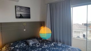 Apartamento mobiliado com ampla vista para o mar no Quilombo
