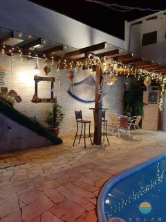 Casa com 03 suítes e área de festas com piscina aprox. 352m da Praia de Armação em Penha/SC. Ref. 107