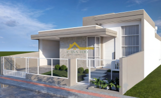 Casa moderna com 3 quartos sendo 1 suíte e área de lazer com piscina.
