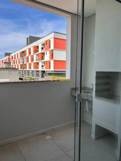 Apto novo, dois dormitórios, sacada com churrasqueira e vaga de garagem livre